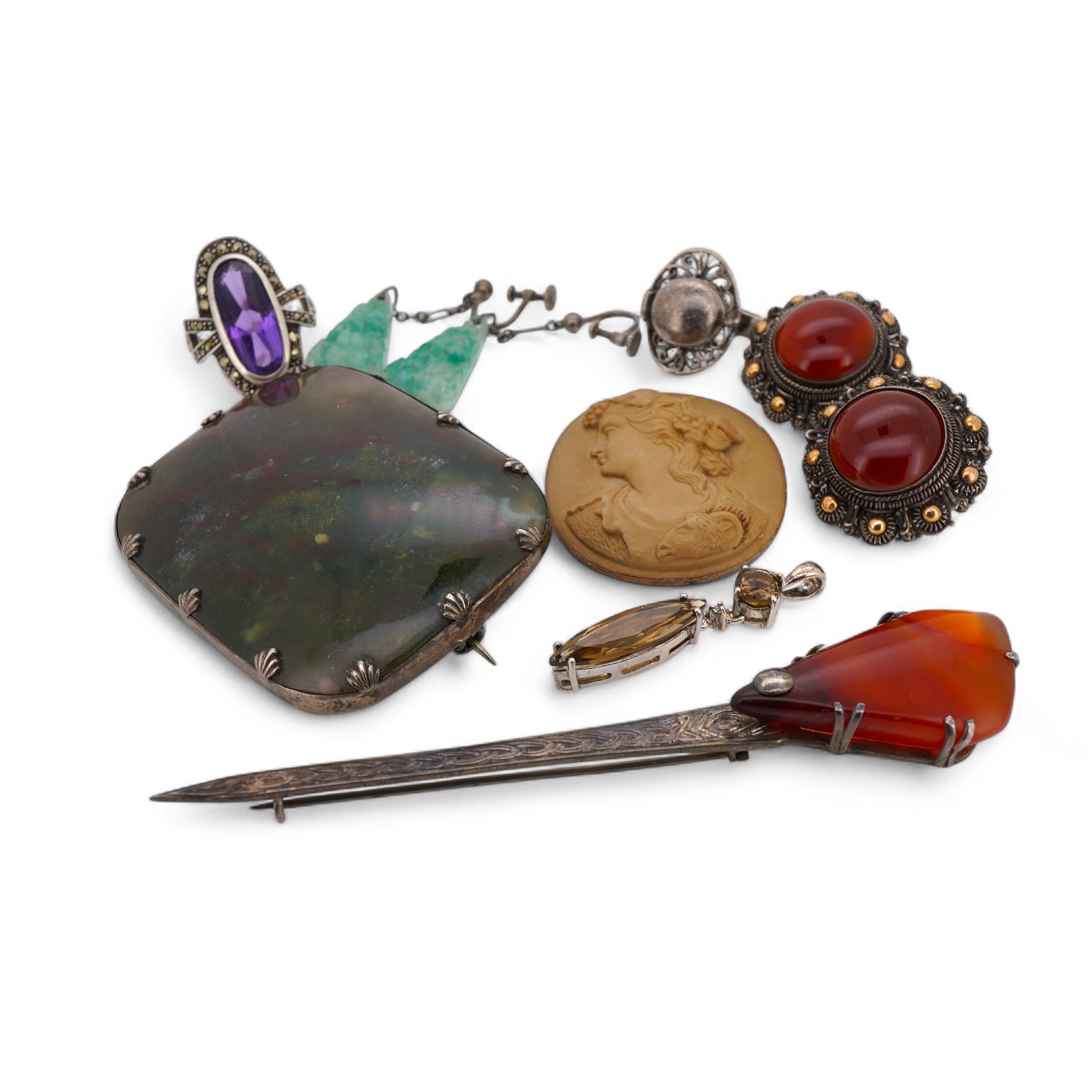 A small group of Victorian and later jewellery, including a white metal mounted bloodstone brooch, 57mm, lave cameo, rings, etc.